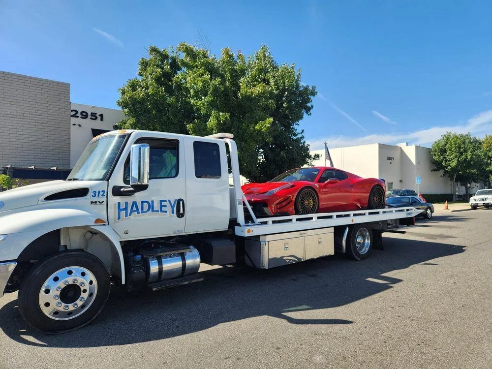 Red Ferrari carried on Hadley flatbed 312