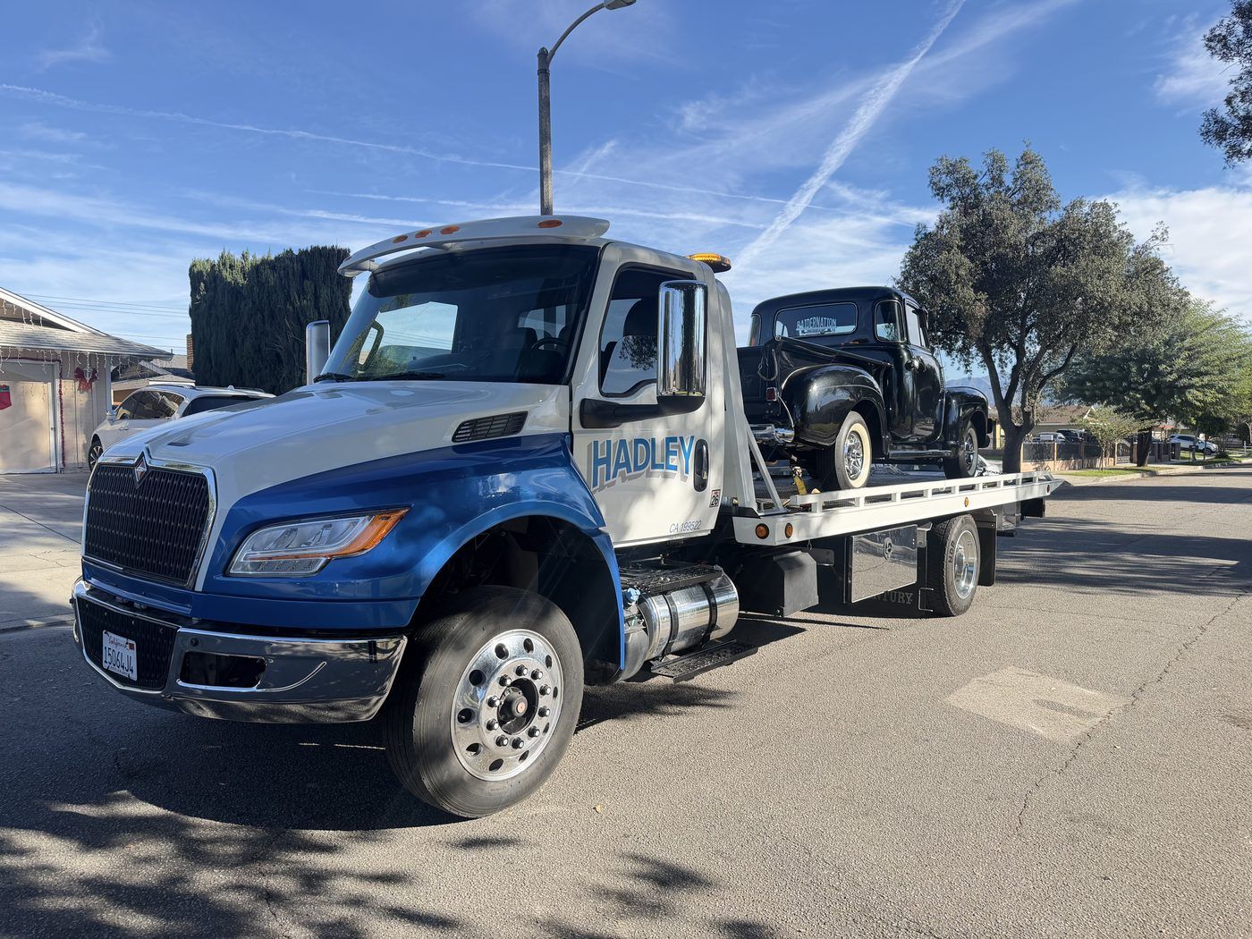 Hadley Tow flatbed transporting two motorcycles in SoCal